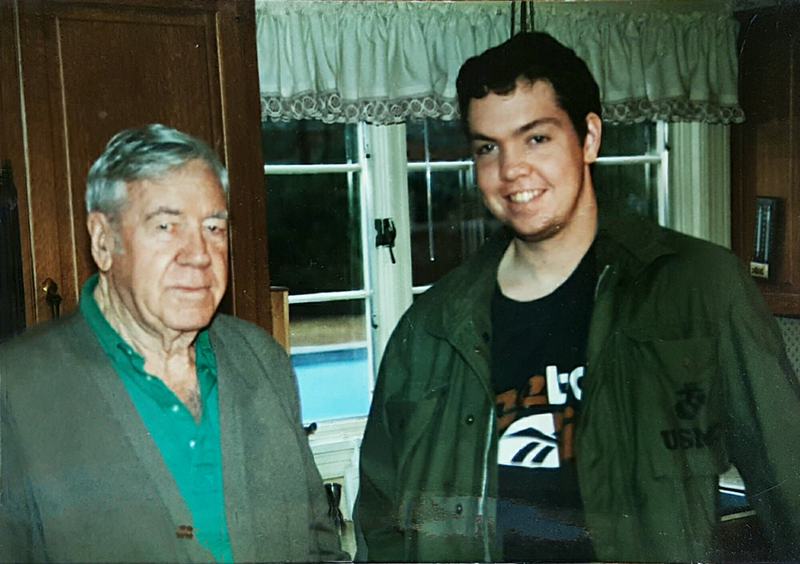 Grandfather and Grandson posing for a photo.